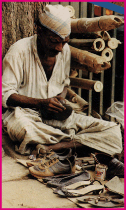 man repairing shoes