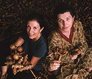  Amanda Murphy and Anita Roddick (Body Shop) amongst a sea of wooden massage rollers from Tirumangalam
