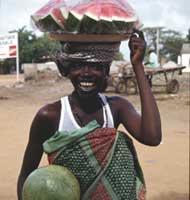 Woman Carrying Melons