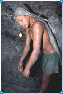 Some young Colombians work in coal mines. The work is dangerous and the hours are long.