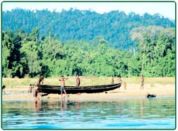 Orang Asli on the river bank