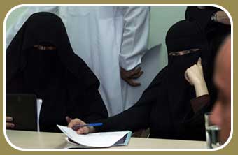 Two Saudi women journalists attend a news conference for the UN Commission on Human Rights in Riyadh, October 2002.