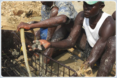 Workers washing gravel for diamonds, Sierra Leone