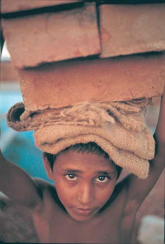 boy working in a brick factory