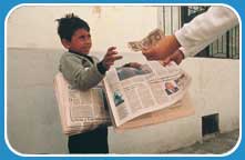 Boy selling Newspapers